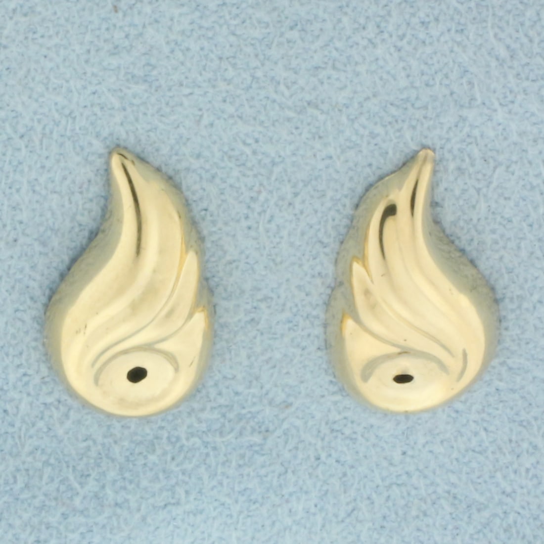 Wing Design Earring Jackets Enhancers in 14k Yellow Gold: In 14k Yellow Gold. 5/8 inch long. 3/8 inch wide. Made to fit around stud earrings to give a fresh new look. 0.5g.