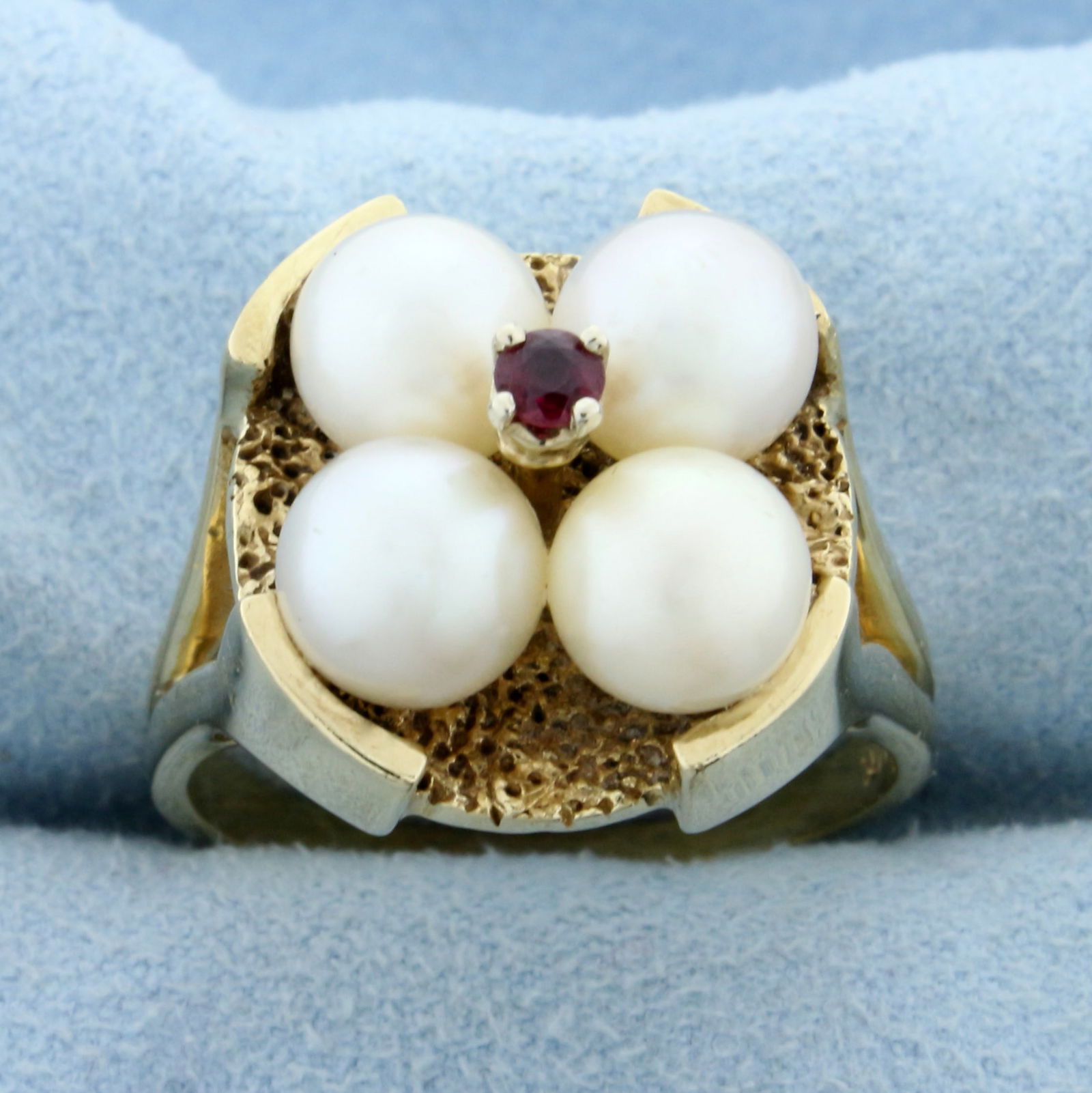 Vintage Akoya Pearl and Ruby Satement Ring in 14K Yellow Gold: In 14K Yellow Gold. Contains four 7mm Cultured Akoya Pearls with creamy white color and pink undertones, beautiful nacre and luster. Also contains one high quality natural .09ct round cut Ruby gemston