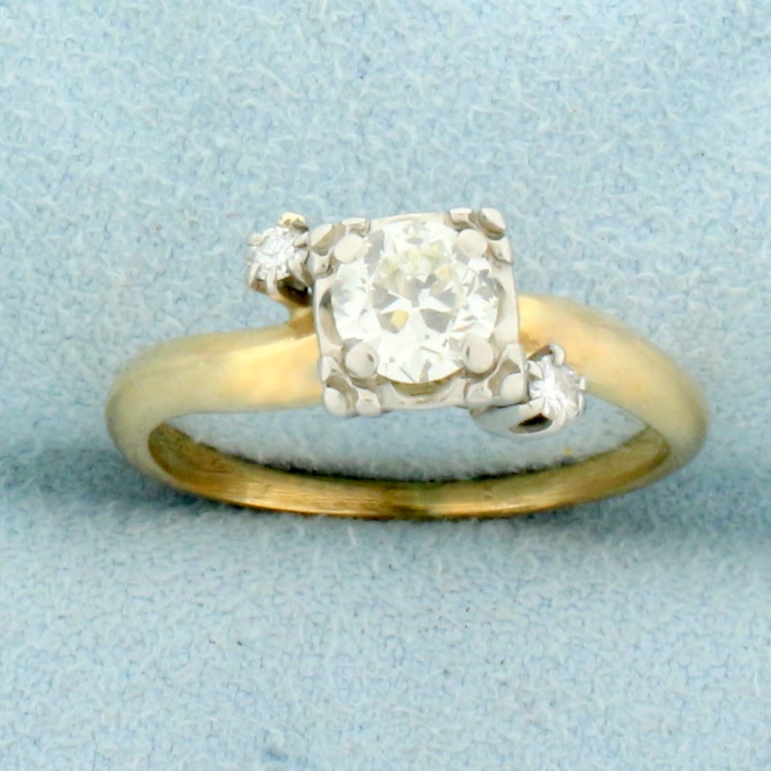 Antique Old European Diamond Engagement Ring in 14K Yellow and White Gold: In 14K Yellow and White Gold. Contains one high quality 1/2ct Old European cut Diamond, VS clarity/J color. Also contains two high quality .03ct Diamonds of similar high quality. Size 6 3/4. 3.0g.