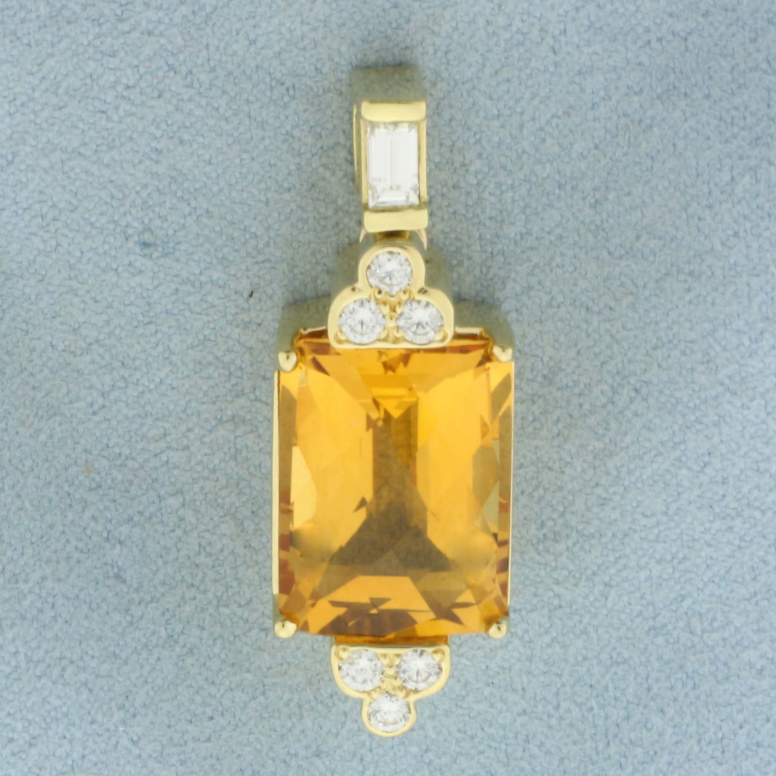 Checkerboard Cut Citrine and Diamond Pendant in 18k Yellow Gold: In 18k Yellow Gold. Contains one 12x16.5mm high quality fancy checkerboard cut natural Citrine gemstone with intense color and excellent clarity. Also contains one .15ct emerald cut and six .05ct roun