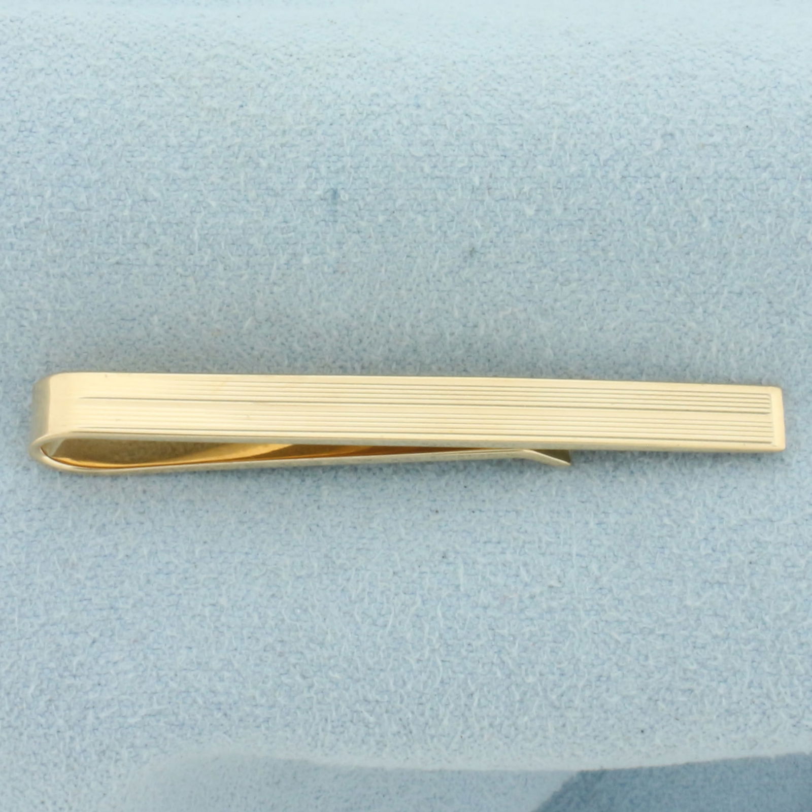 Tiffany and Co. Bar Tie Clip in 14k Yellow Gold: In 14k Yellow Gold. 1 3/4 inch long. 4.3mm wide. Guaranteed authentic. 3.8g.