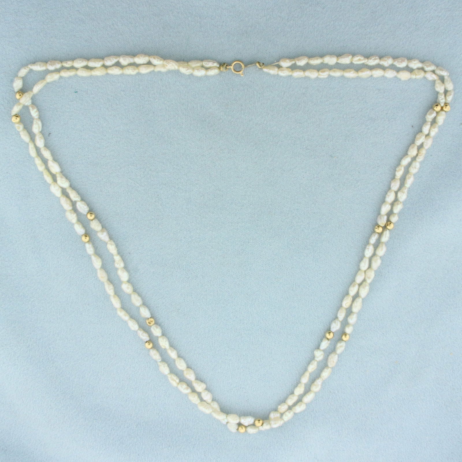 Double Strand Freshwater Pearl and Gold Bead Necklace in 14k Yellow Gold: In 14k Yellow Gold. Contains 5mm high quality Freshwater Pearls with high luster. 17 inches long. Hand strung. Spring clasp. 8.6g.