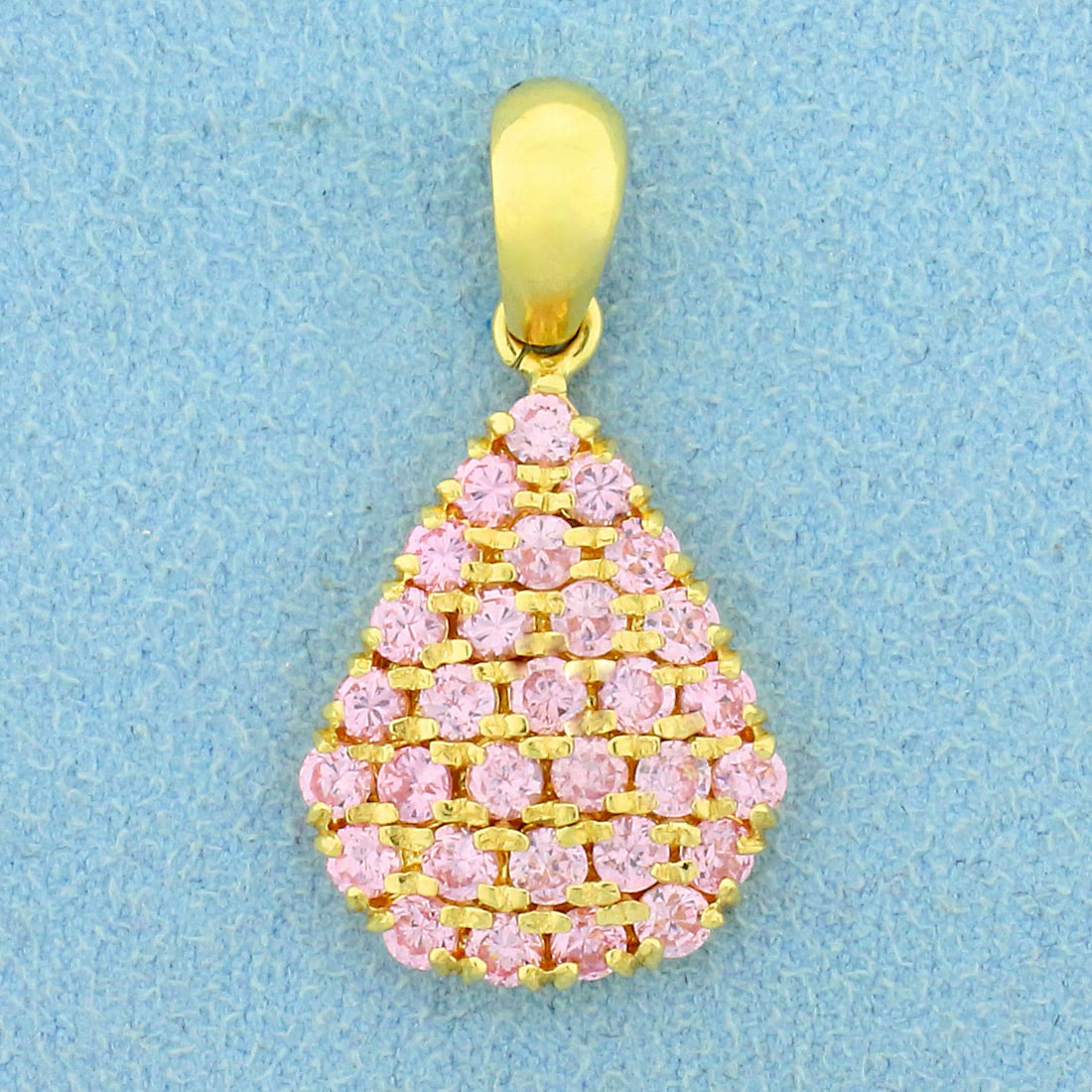 Designer Morganite Teardrop Pendant in 18K Yellow Gold: In 18K Yellow Gold. Contains thirty high quality natural .05ct Morganite gemstones with beautiful pink salmon color and excellent clarity. 1 1/4 inches long. 5/8 inch wide. 4.7g