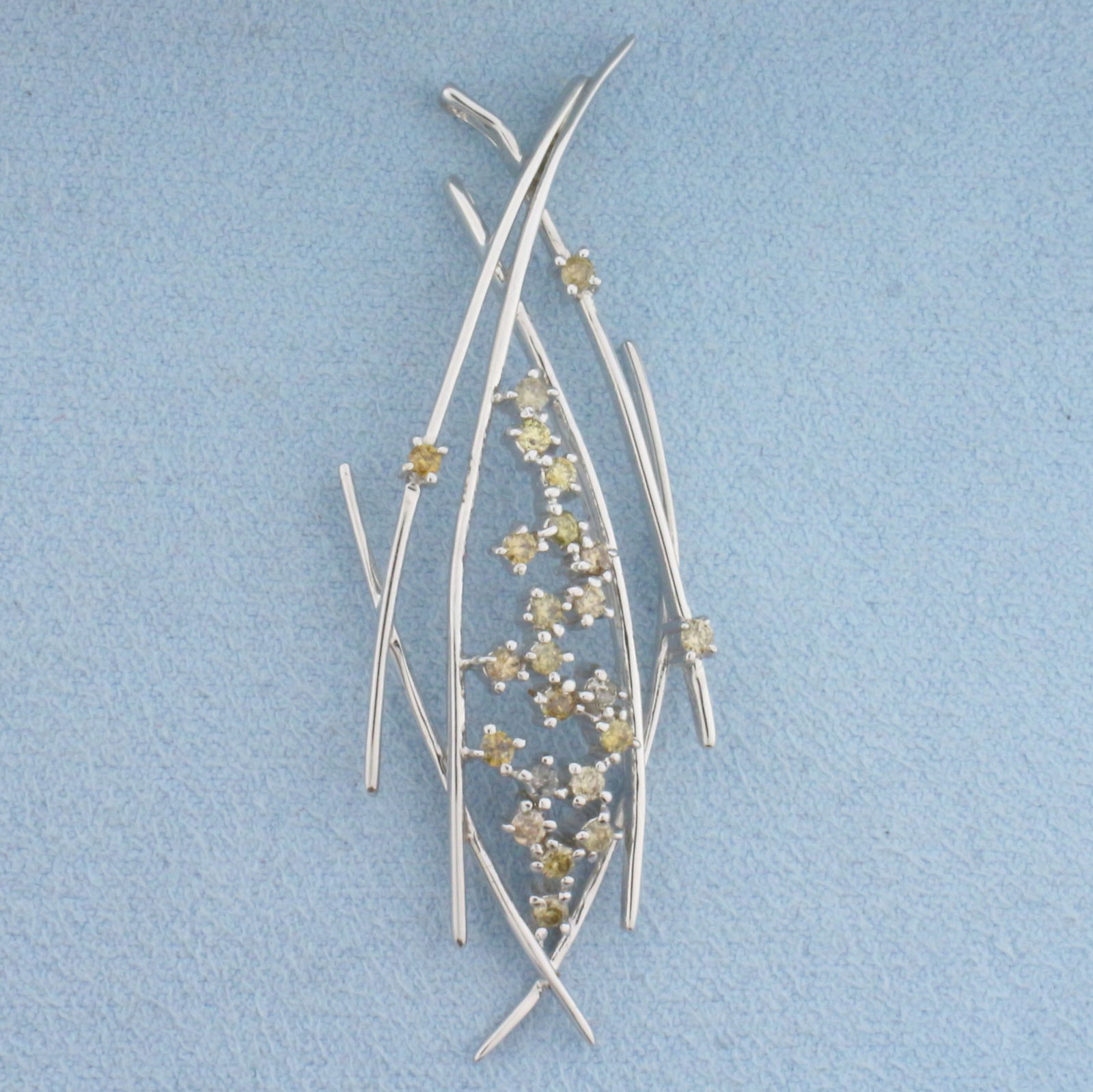 Chocolate and Champagne Diamond Abstract Pendant in 18K White Gold: In 18K White Gold. Contains twenty three high chocolate and champagne diamonds, 1/2ct TW, with warm light brown and yellow colors. 2 1/4 inches long, 3.4 inch wide. 6.2g.