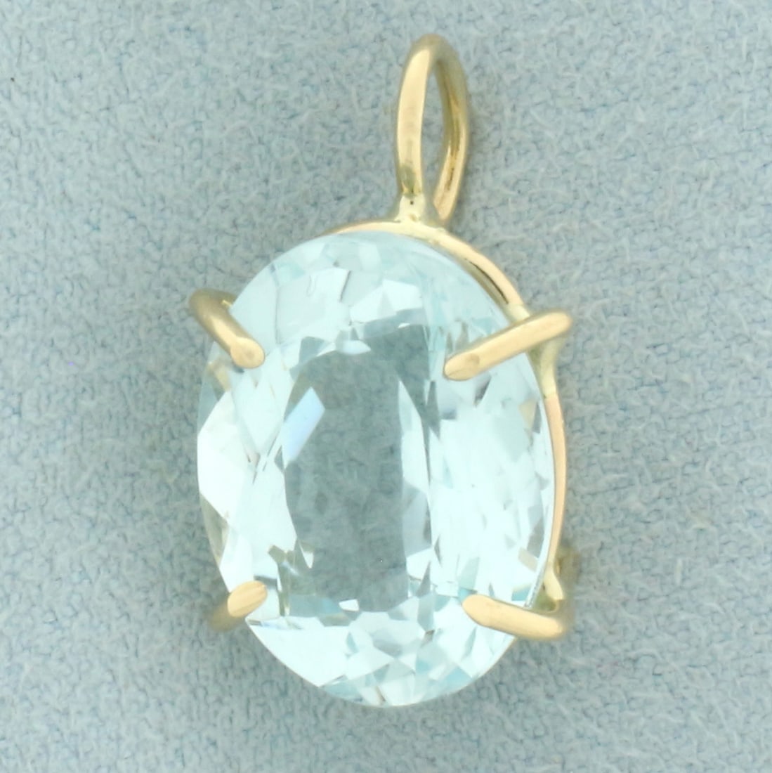 8CT Aquamarine Solitaire Pendant in 14k Yellow Gold: In 14k yellow gold. Contains 1 high quality oval cut aquamarine gemstone, 15.8mmx12mm, approximately 8cts, with bright aqua color and excellent clarity. 7/8 inches long and 1/2 inches wide. 3.9g.
