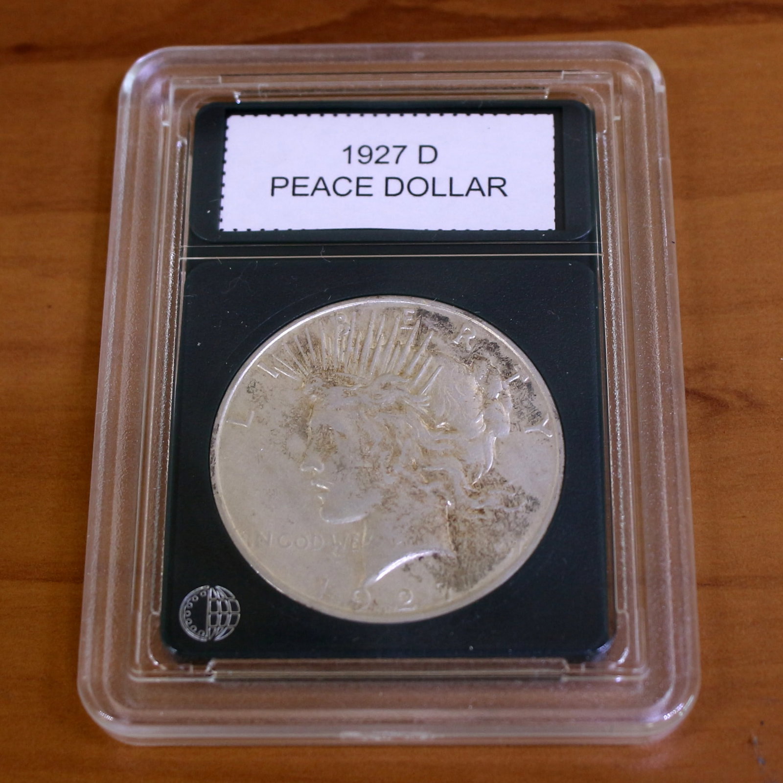 1927D Peace Silver Dollar Coin Key Date in Slab: Condition Shown in picture. From CoinWorld. Key Date.
