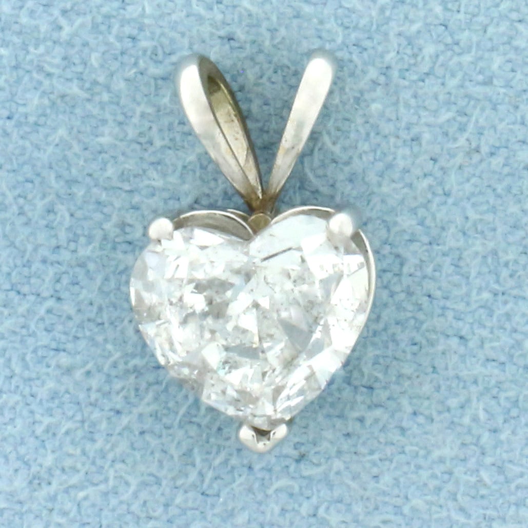 Diamond Heart Pendant in 14k White Gold: In 14k white gold. Contains one heart shaped 1 2/3ct high quality diamond, F color/I clarity, very white stone with a great cut for lots of sparkle. 5/8 inch long, 3/8 inch wide. 1.2g.