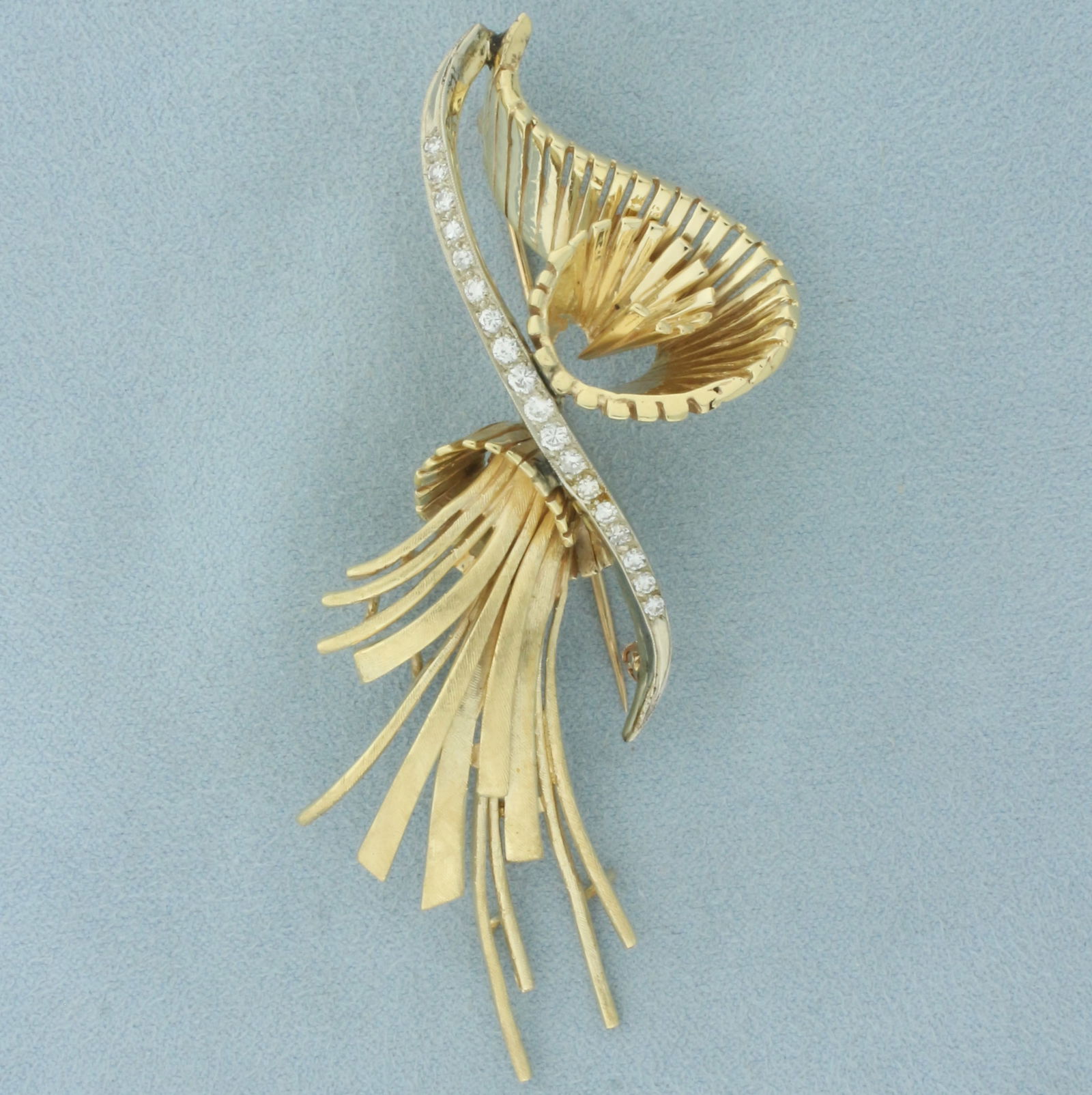 Diamond Tassel and Spiral Design Brooch in 14k Yellow Gold: In 14k yellow gold. Contains 18 high quality diamonds, 1/2ct TW, VS clarity/G color. 3 3/8 inches long x 1 3/8 inches wide.