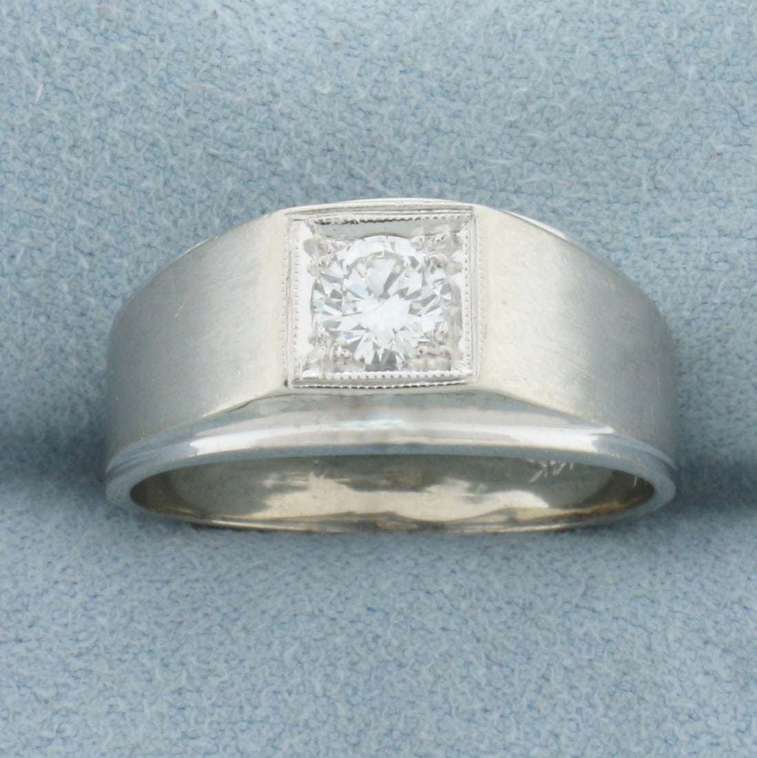 Men's Illusion Set Diamond Ring in 14k White Gold: In 14k white gold. Contains one high quality 1/2ct round brilliant diamonds, SI1 clarity, G color, eye clean, great cut for lots of brilliance. Satin finish shoulders. Size: 9.75. 6.8g.