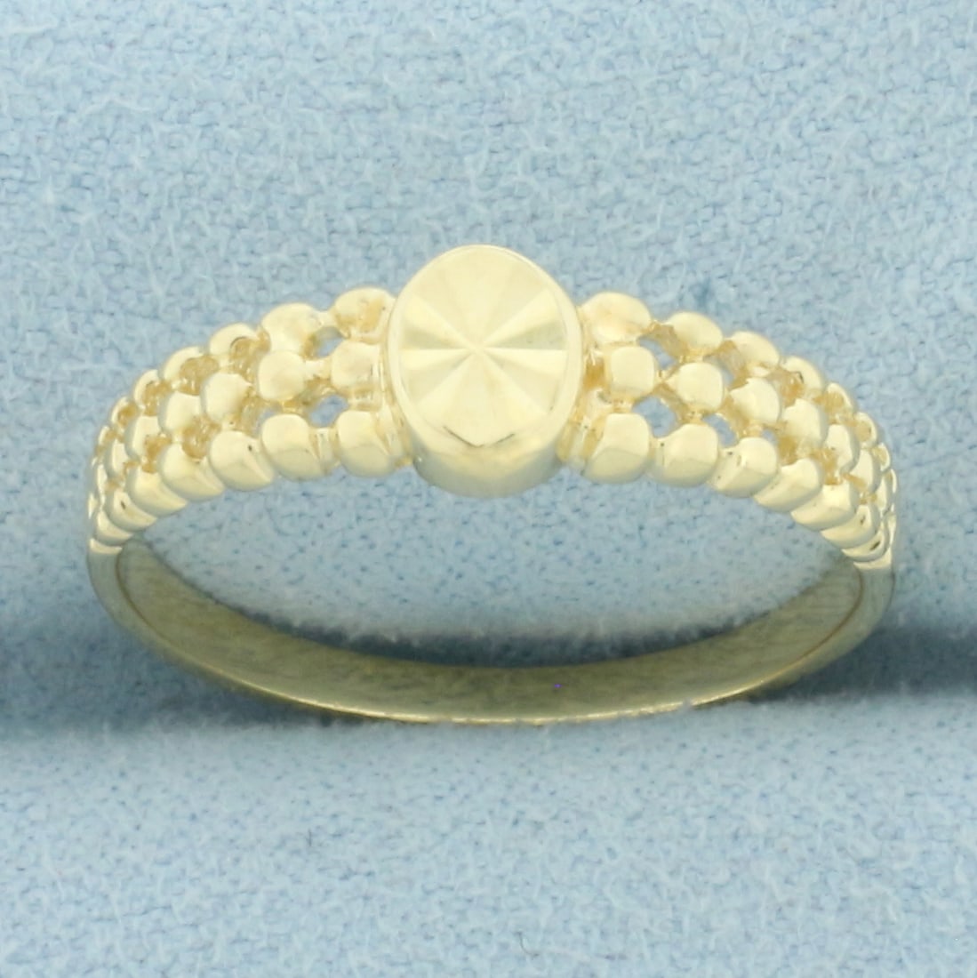 Beverly Hills Gold Diamond Cut Star Center Ring in 14k Yellow Gold: In 14k yellow gold. Beverly Hills Gold designer. 6.5mm wide at center. Size: 8.75. 2.3g.