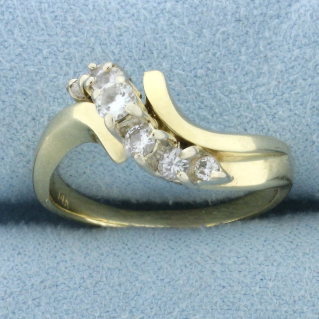 Diamond Waterfall Ring in 14k Yellow Gold: In 14k Yellow Gold. Contains one 1/8ct, four .07ct, and two .03ct high quality diamonds, VS clarity/H color . Size 8. 5.3g.