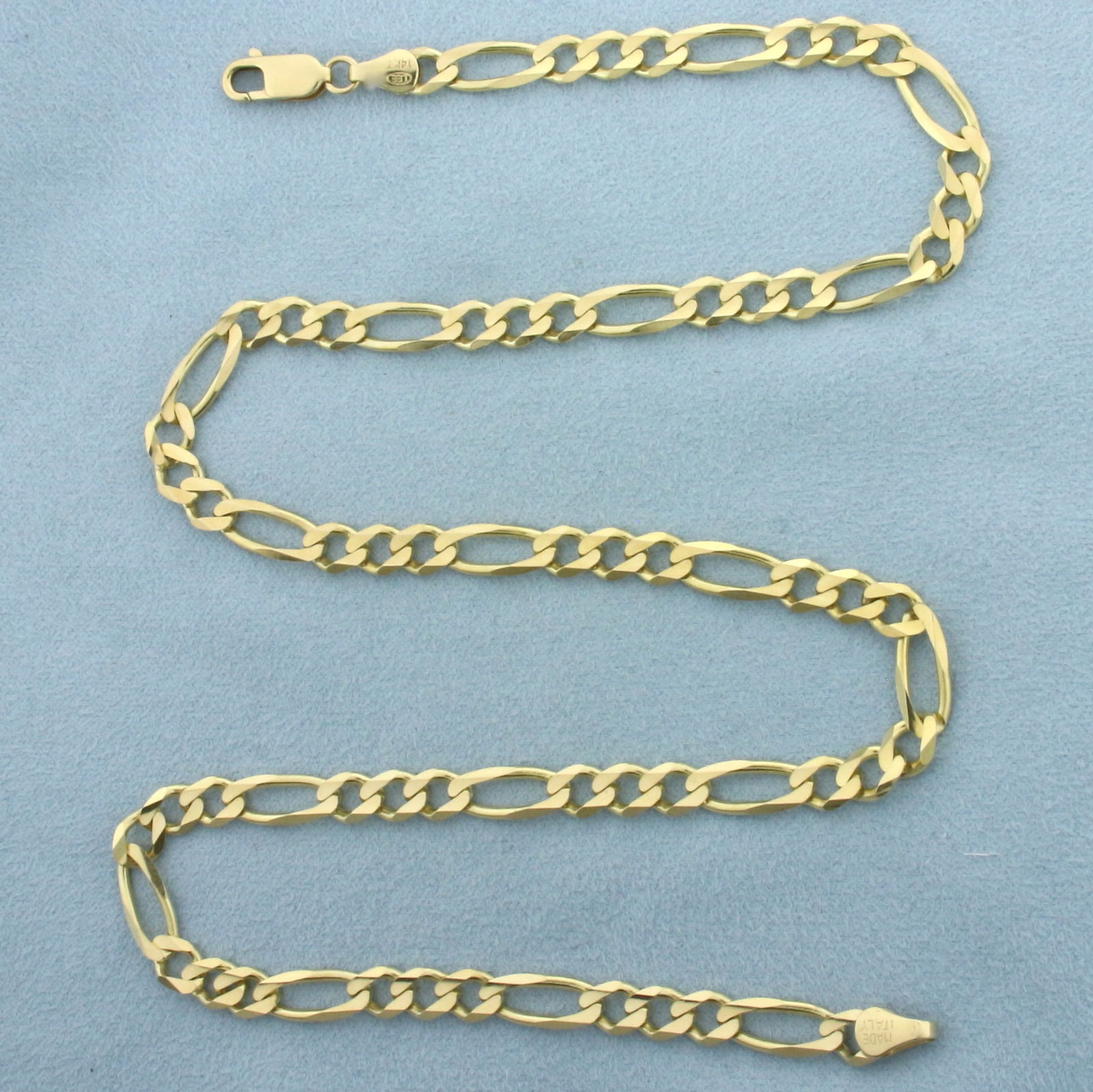 20 Inch Italian Figaro Link Chain Necklace in 14k Yellow Gold: In 14k Yellow Gold. 20 inches long. 6mm wide. Italian made. Lobster clasp. 23.7g.