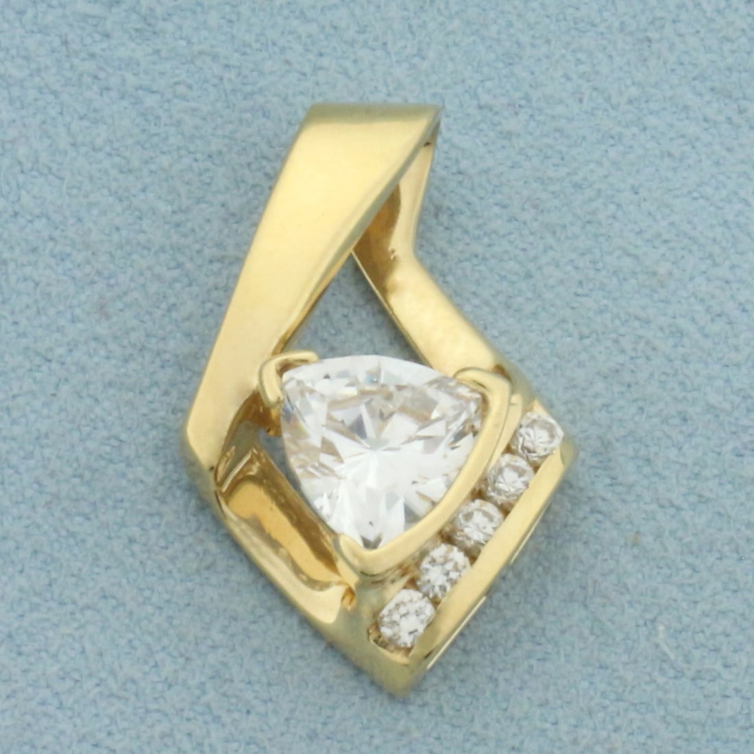 Trillion CZ Pendant or Slide in 14k Yellow Gold: In 14k Yellow Gold. Contains one 9mm trillion and five 2mm high quality CZ gemstones. 7/8 inch long. 5/8 inch wide. 3.8g.