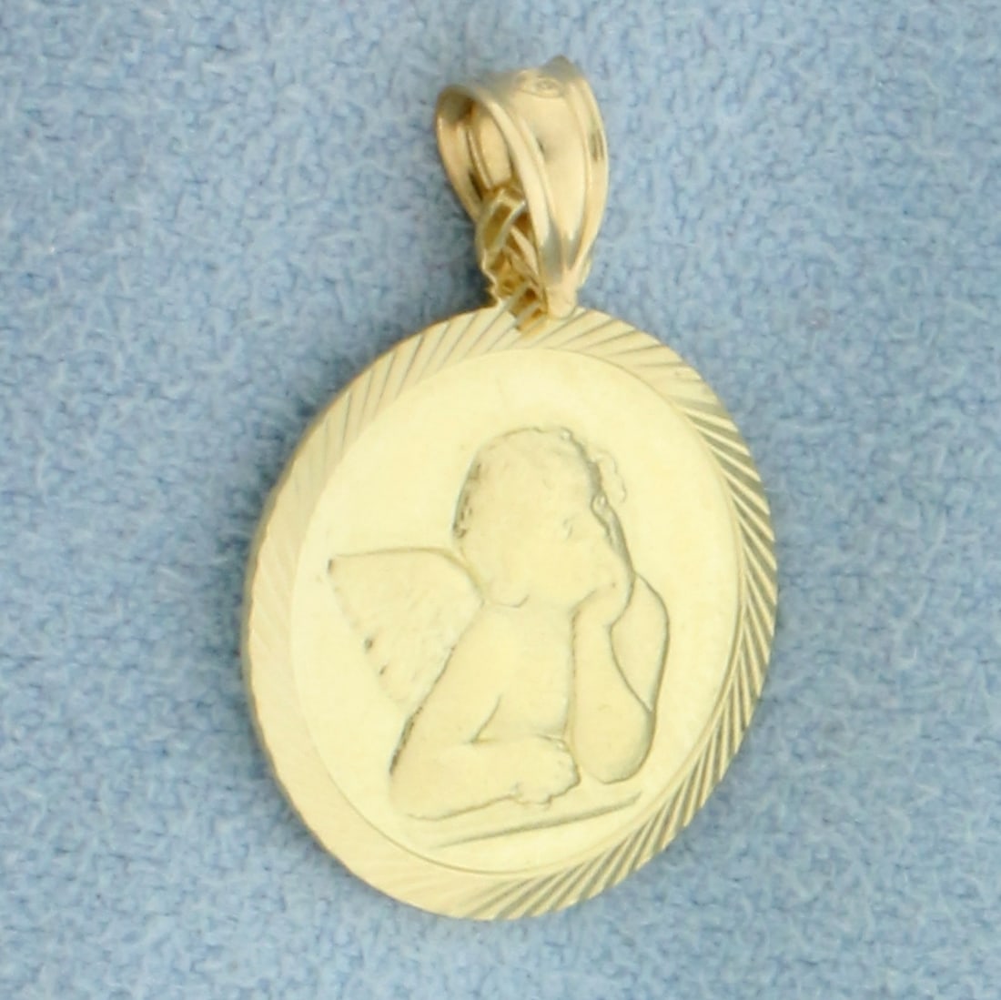 Angel Cherub Medallion Pendant in 14k Yellow Gold: In 14k Yellow Gold. 7/8 inch long. 5/8 inch wide. 1.5g.