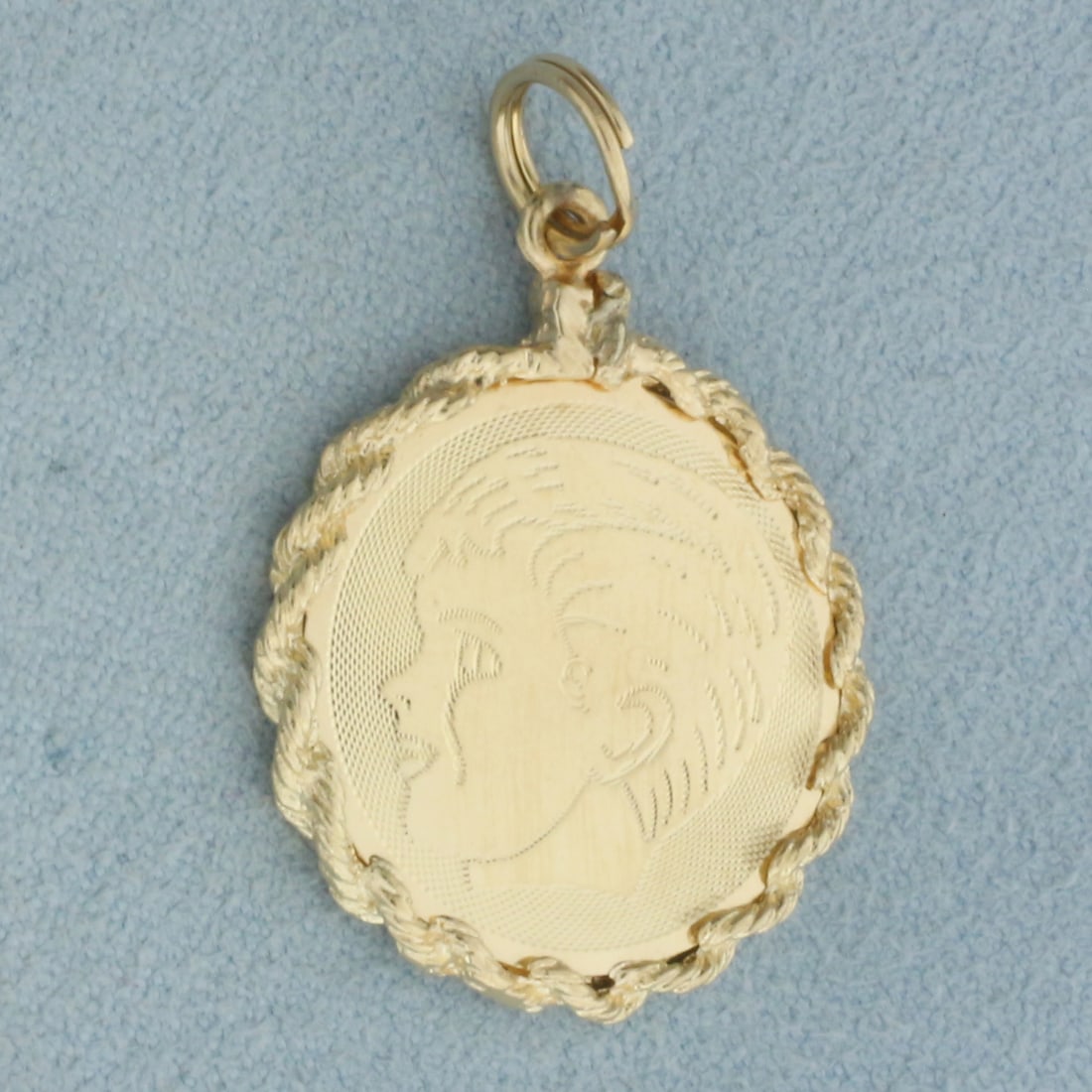 Engravable Boy Head Silhouette Charm or Pendant in 14k Yellow Gold: In 14k Yellow Gold. 1 1/4 inch long. 7/8 inch wide. Split ring for easy attachment. Can engrave name/date on back. 2.8g.