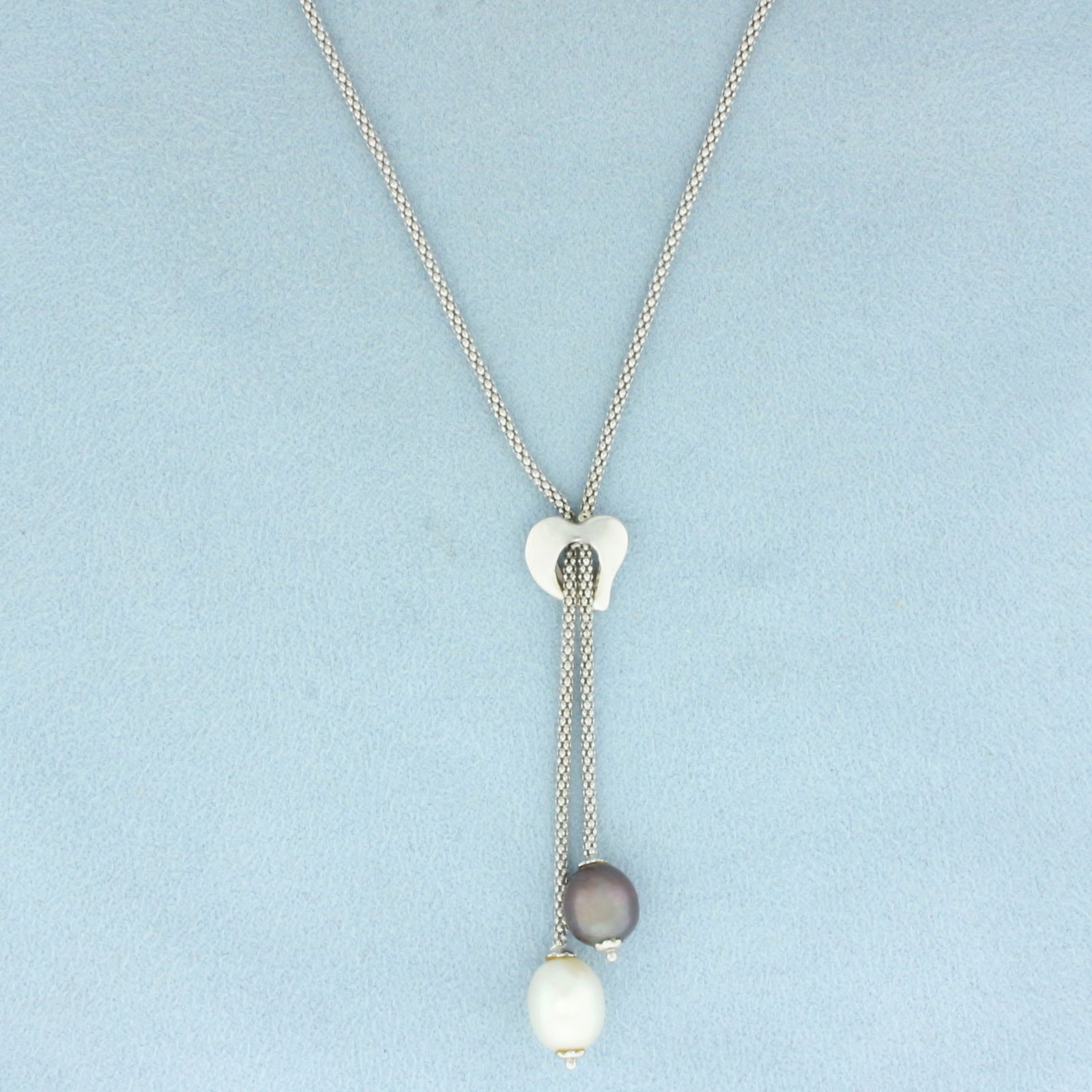 Cultured Tahitian and White Pearl Dangle Lariat Popcorn Necklace in 14k White Gold: In 14k White Gold. Contains one 10.5mm high quality white cultured pearl with high luster. Also contains one 8mm high quality Tahitian pearl with peacock undertone and high luster.19 inches long. 1.5m