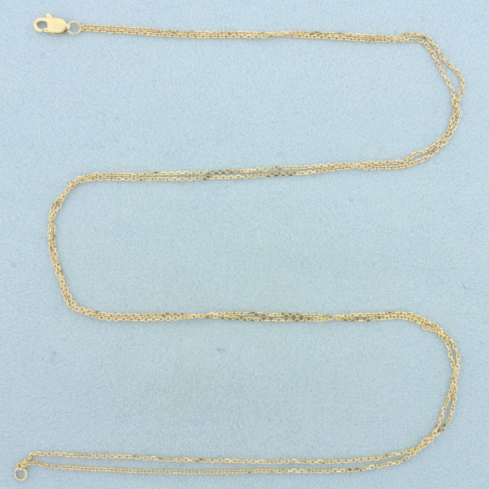 17 Inch Double Cable Link Chain Necklace in 14k Yellow Gold: In 14k Yellow Gold. 17 inches long, 1mm wide each chain. Cable link. Lobster clasp. 2.4g.