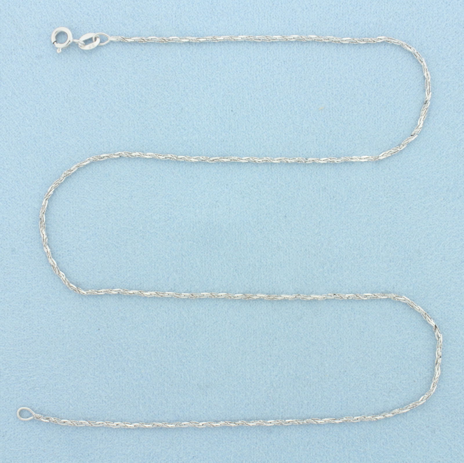 16 Inch Italian Twisting Boston Link Chain Necklace in 14k White Gold: In 14k White Gold. 16 inches long. 1.3mm wide. Made in Italy. Spring clasp. 2.0g.