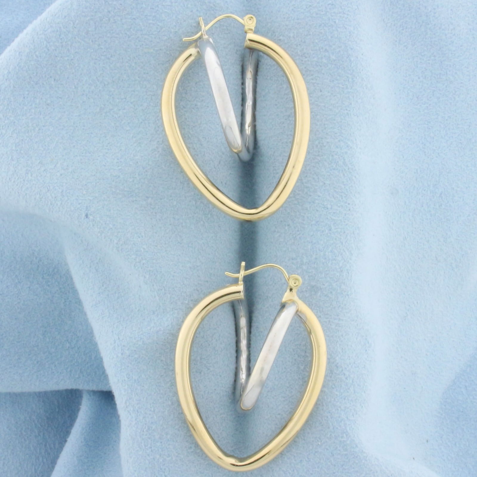 Abstract Heart Hoop Earrings in 14k White and Yellow Gold: In 14k white and yellow gold. 1 1/2 inches long and 1 inch wide. 4.8g.