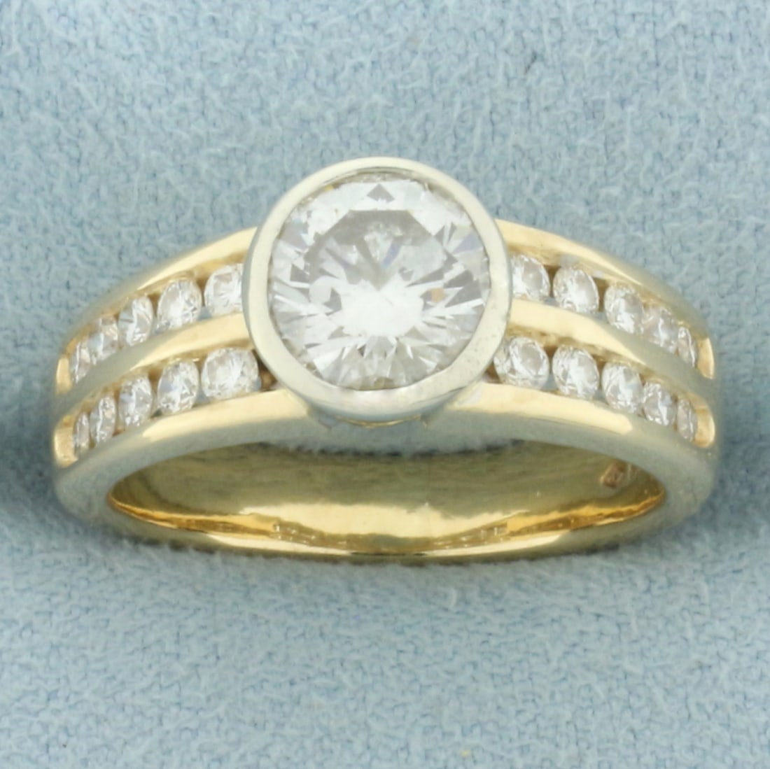 Over 2ct Diamond Bezel Set Engagement Ring in 14k Yellow Gold: In 14k yellow gold. Center diamond is high quality natural 1 2/3ct round brilliant cut, SI clarity/H color, completely eye clean and great cut for lots of sparkle. Accented by 2 rows of 20 channel set