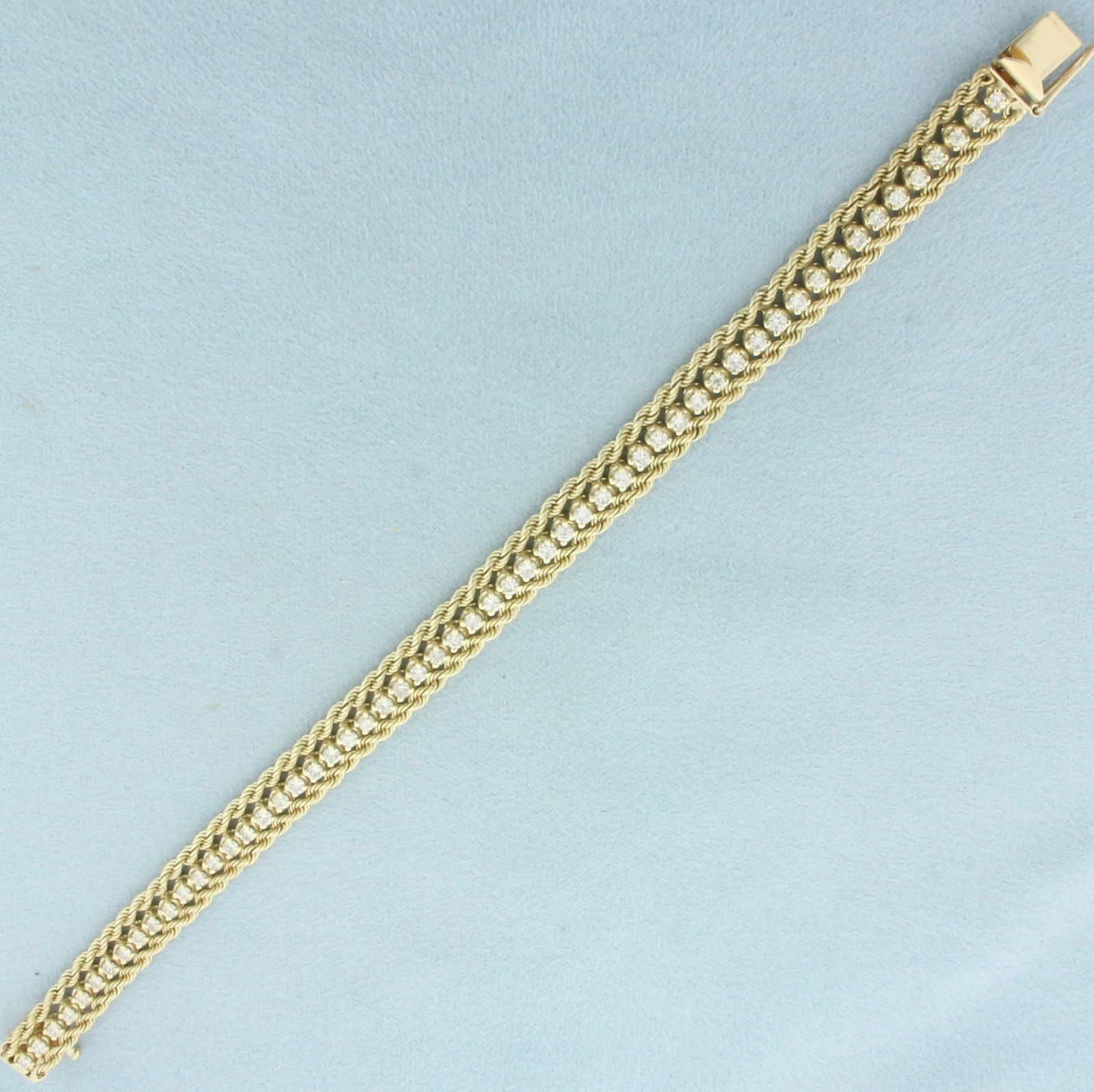 2ct Diamond Rope Link Tennis Bracelet in 14k Yellow Gold: In 14k yellow gold. 7 inches long and 7.5mm wide. Contains 56 high quality diamonds, 2ct TW, SI clarity/H color. Concealed slide clasp with safety latch. 17.7g.