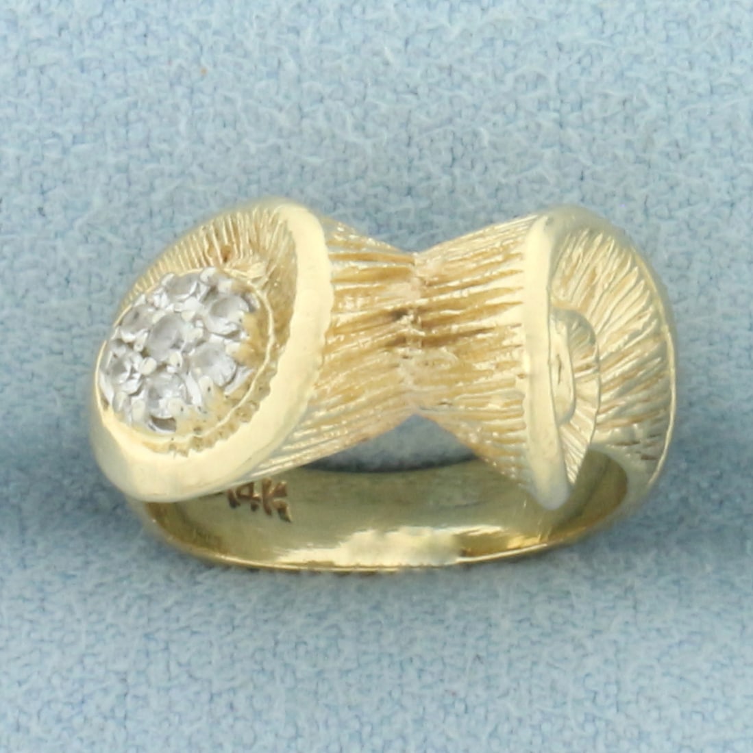 Seashell Scroll Design Pinky Ring in 14k Yellow Gold: In 14k yellow gold. Contains seven high quality .01ct CZ gemstones. 9mm wide at widest point. Size: 2. 5.8g.
