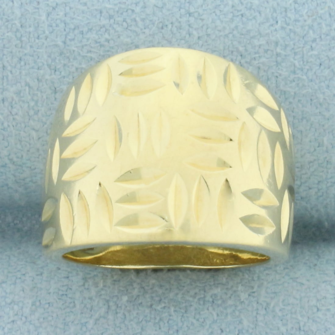 Diamond Cut Pinky Ring in 14k Yellow Gold: In 14k yellow gold. 15mm wide at center. Diamond cut pattern for added brilliance. Size: 3. 7.8g.