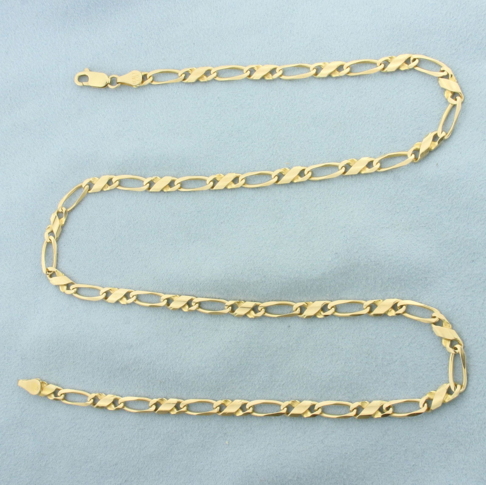 Italian 21 Inch Figaro Link Chain Necklace in 14k Yellow Gold: In 14k Yellow Gold. 21 inches long. 4.3mm wide. Italian made. Lobster clasp. 19.5g.