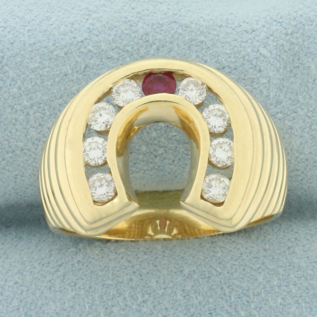 Mens Ruby and Diamond Lucky Horseshoe Ring in 14k Yellow Gold: In 14k Yellow Gold. Contains one 3mm high quality natural Ruby gemstone with vibrant color and excellent clarity. Also contains eight .10ct high quality diamonds, VS clarity/G color. .16.5mm wide top.