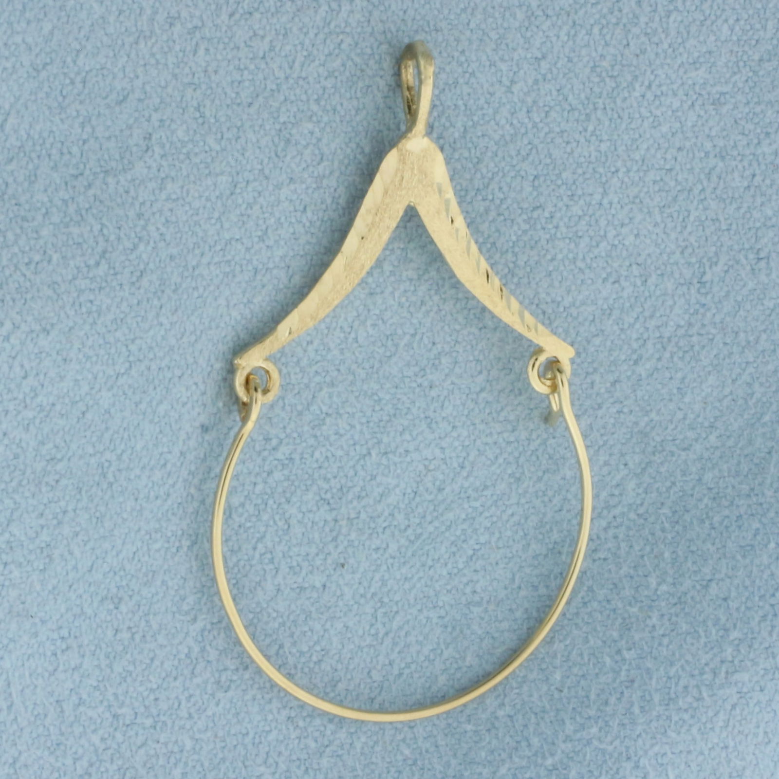 Diamond Cut Charm Holder Pendant in 14k Yellow Gold: In 14k Yellow Gold. 1 1/2 inches long. 1 inch wide. 1.1g.