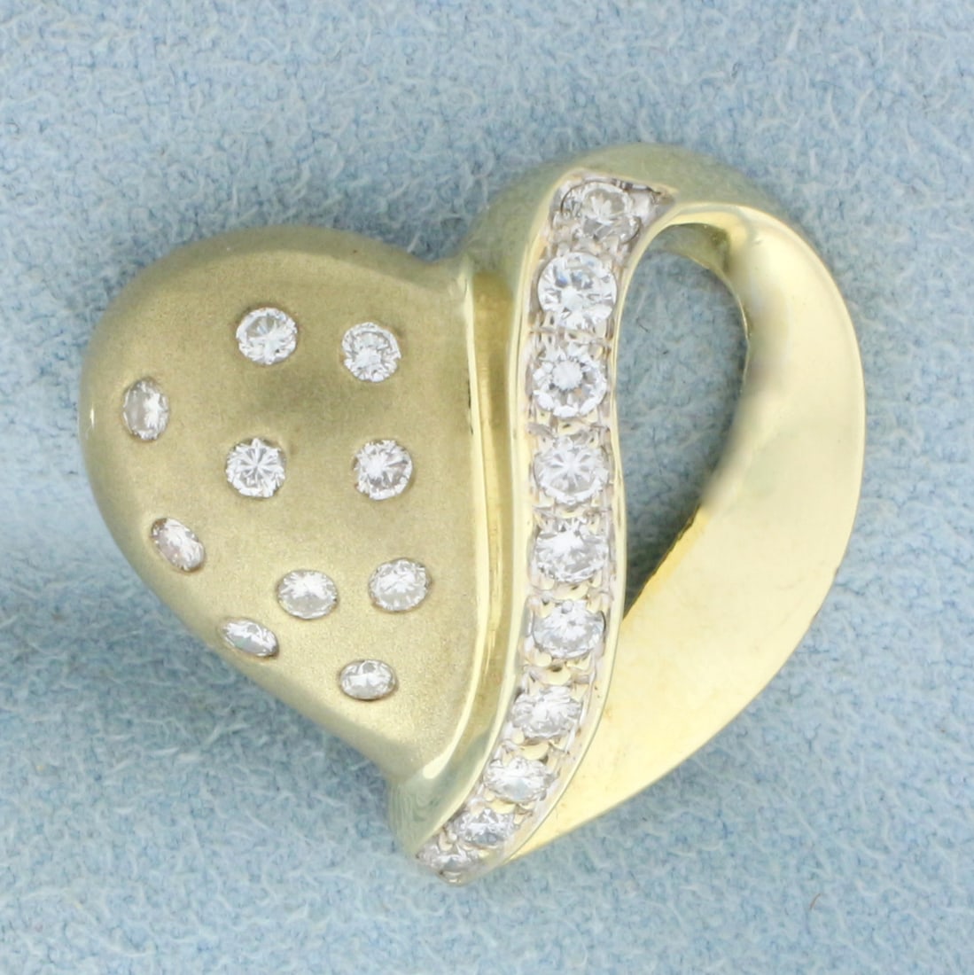Unique Diamond Heart Pendant in 14K Yellow Gold: In 14K Yellow Gold. Contains ten .05ct Diamonds and ten .03ct Diamonds all high quality SI clarity/H color. Unique matte and high gloss dual finish. 7/8 inch long. 5.3g.