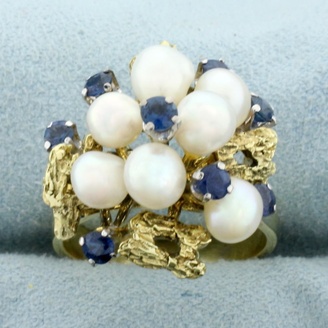 Vintage Sapphire and Akoya Pearl Cocktail Ring in 14K Yellow Gold: In 14K Yellow Gold. Contains seven high quality natural 5mm Cultured Akoya Pearls with high luster. Also eight high quality natural 3mm Sapphire gemstones with intense blue color and excellent clarity