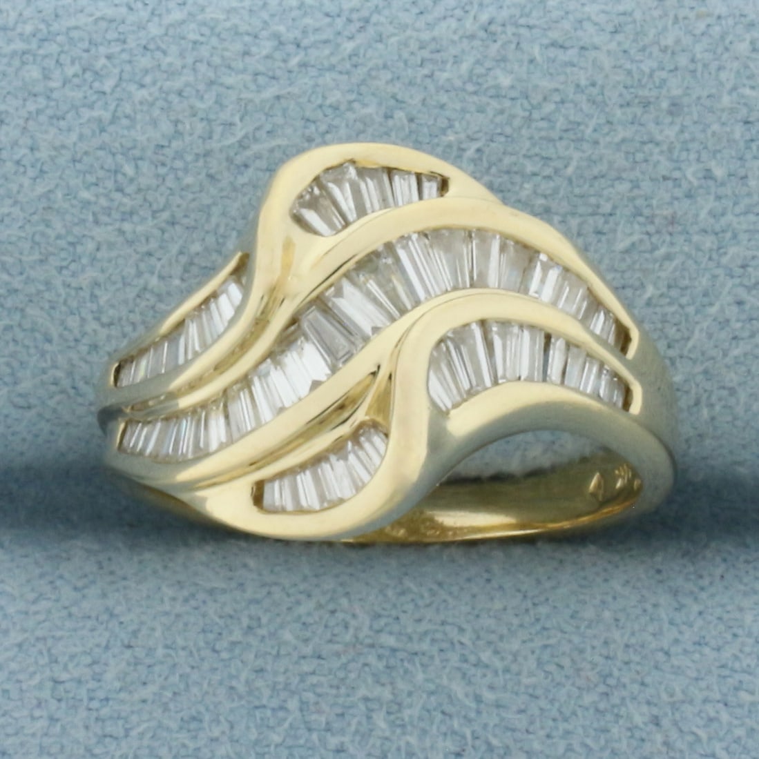 Baguette Diamond Wave Design Ring in 14k Yellow Gold: In 14k Yellow Gold. Contains fifty-one high quality baguette diamonds, 1ct TW, VS clarity/H color. 13.5mm wide. Size 7. 5.0g.