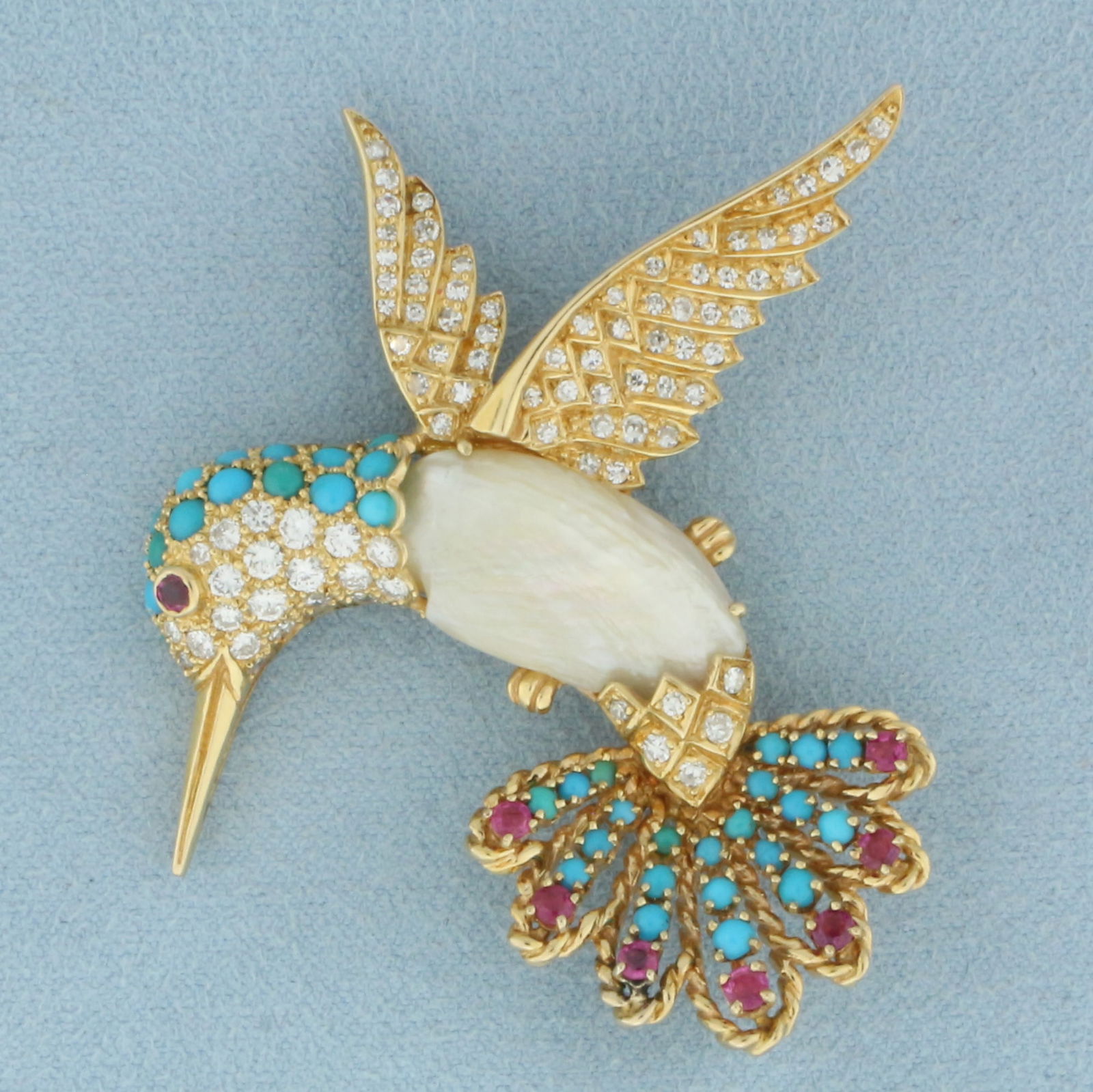 Hummingbird Broach Pin with Diamond, Ruby, Turquoise, and Pearl in 18k Yellow Gold: In 18k Yellow Gold. Contains 91 high quality diamonds, 3ct TW, VS clarity/F color. Also contains eight 2.5mm high quality natural Ruby gemstones with vibrant color and excellent clarity. Also contains