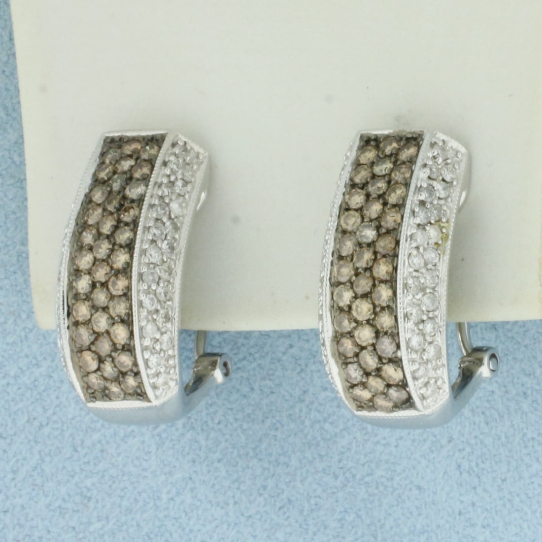 Chocolate and White Pave Diamond Earrings in 14k White Gold: In 14k White Gold. Contains sixty-eight .01ct high quality chocolate diamonds with warm color and excellent clarity. Also contains eighty 1/2pt "white" diamonds. 3/4 inch long. 3/8 inch wide. 8.2g.
