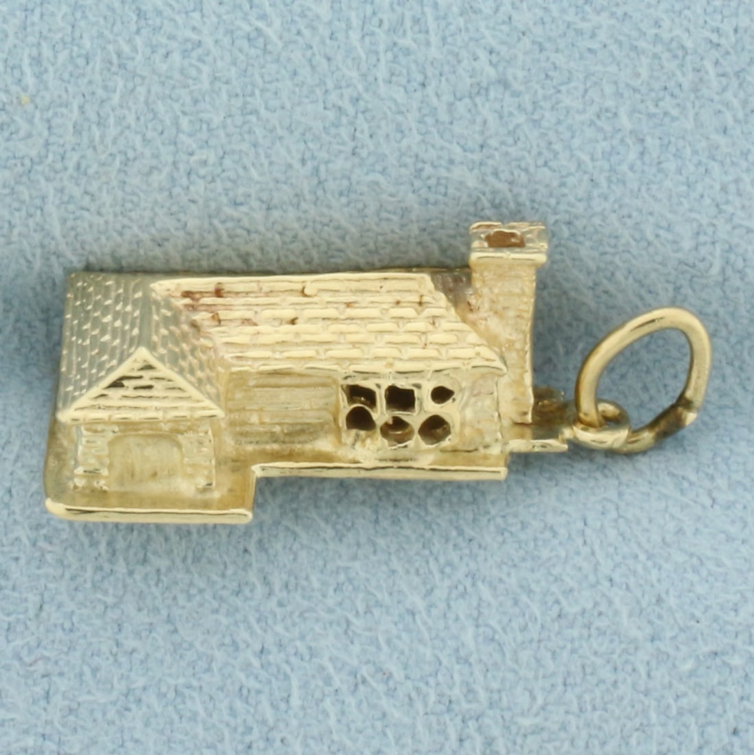 3D House Charm in 14k Yellow Gold: In 14k Yellow Gold. 1 inch long including jump ring. 1/2 inch wide. 4.3g.