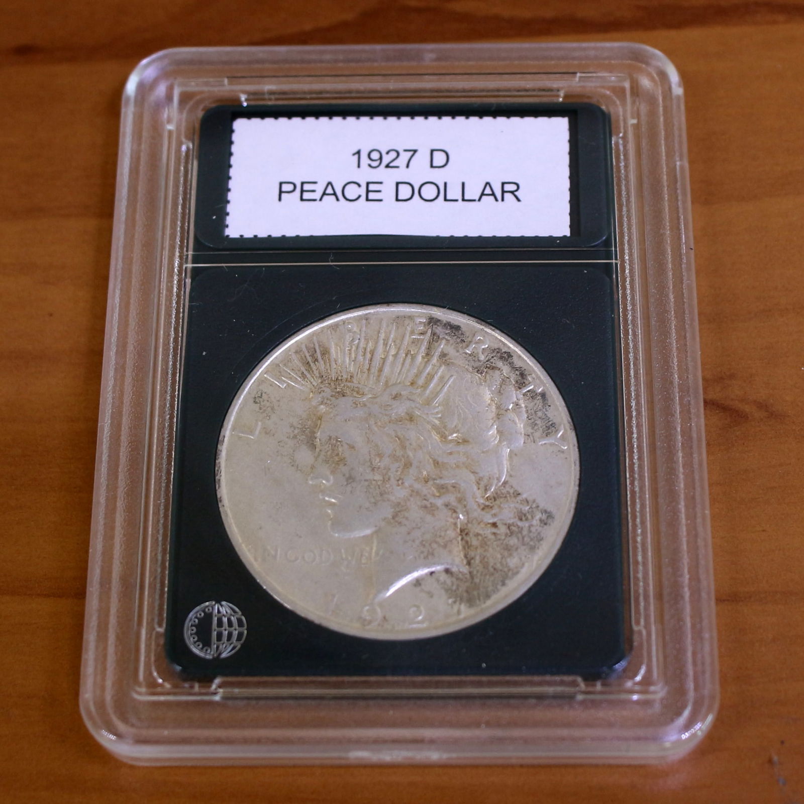 1927D Peace Silver Dollar Coin Key Date in Slab: Condition Shown in picture. From CoinWorld. Key Date.