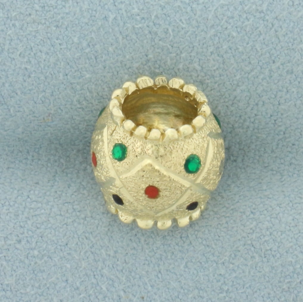 Enamel Bead Pendant in 10k Yellow Gold: In 10k yellow gold. 1/2 inch long and 1/2 inches wide. Enamel looks like ruby, emerald, and sapphire gemstones. 3.2g.