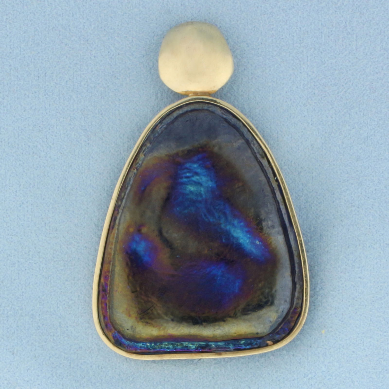 Dichroic Glass Statement Pendant in 14k Yellow Gold: 14k yellow gold bezel and bale. 2 3/8 inches long and 1 1/2 inches wide. 33.8g.
