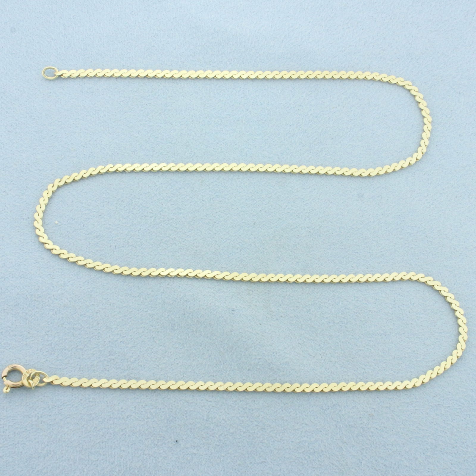 Italian 18 Inch S-Link Serpentine Chain Necklace in 14k Yellow Gold: In 14k Yellow Gold. 18 inches long. 2mm wide. Spring clasp. Italian made. 7.1g.