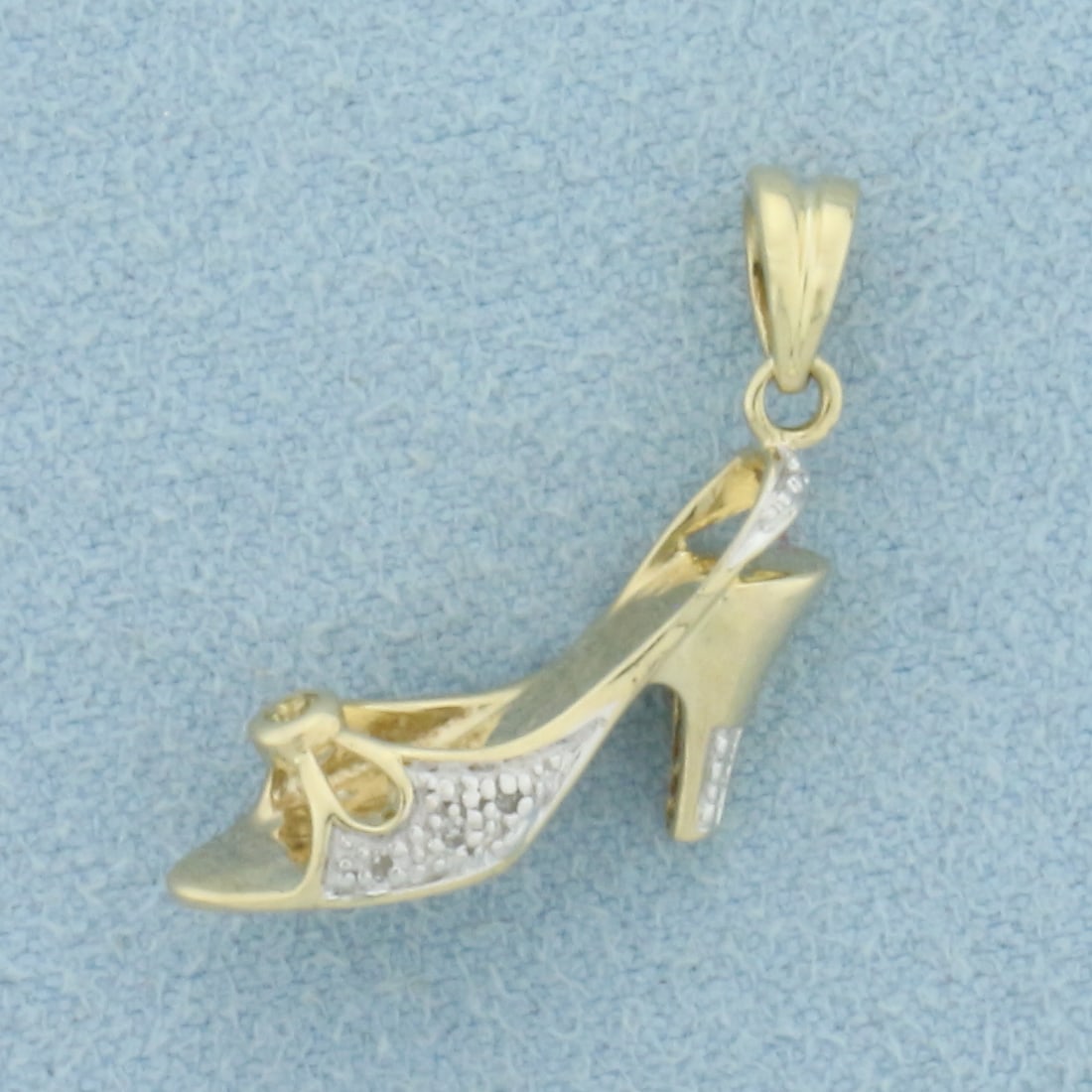 diamond High Heel Pendant or Charm in 10k Yellow Gold: In 10k Yellow Gold with White Gold Accents. Contains six 1/2pt and one .02ct high quality diamonds. 1 inch long. 1.4g.