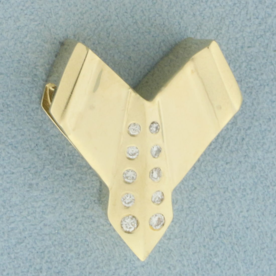 Modern Design Diamond Slide Pendant in 14k Yellow Gold: In 14k Yellow Gold. Contains ten high quality diamonds, 1/4ct TW, VS clarity/G color. 1 inch long. 3/4 inch wide. 6.7g.