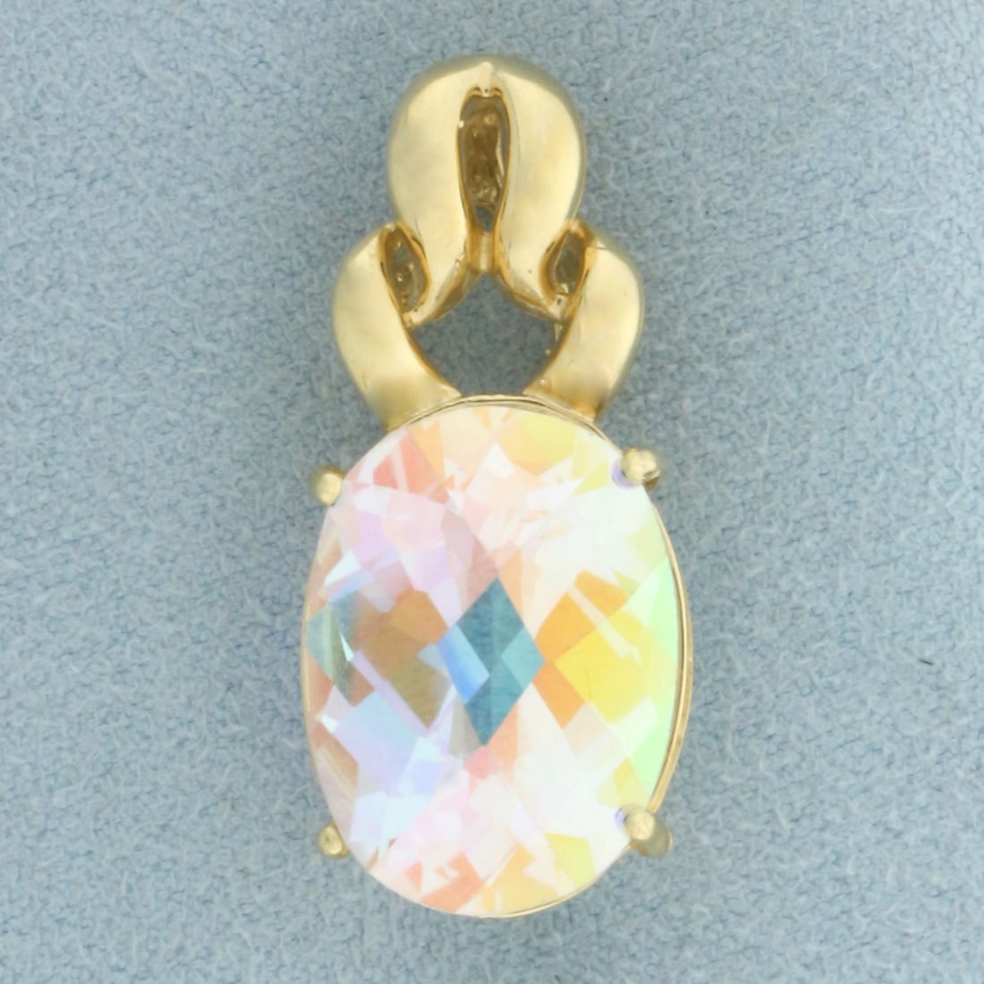 Mercury Mist Mystic Topaz Pendant in 14k Yellow Gold: In 14k Yellow Gold. Contains one 18x13mm high quality checkerboard cut Mercury Mist Mystic Topaz gemstone with vibrant color and excellent clarity. 1 1/4 inch long. 1/2 inch wide. 7.4g.