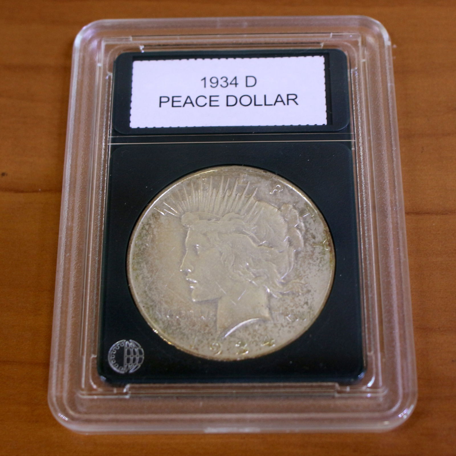 1934D Peace Silver Dollar Coin Key Date in Slab: Condition Shown in picture. From CoinWorld. Key Date.
