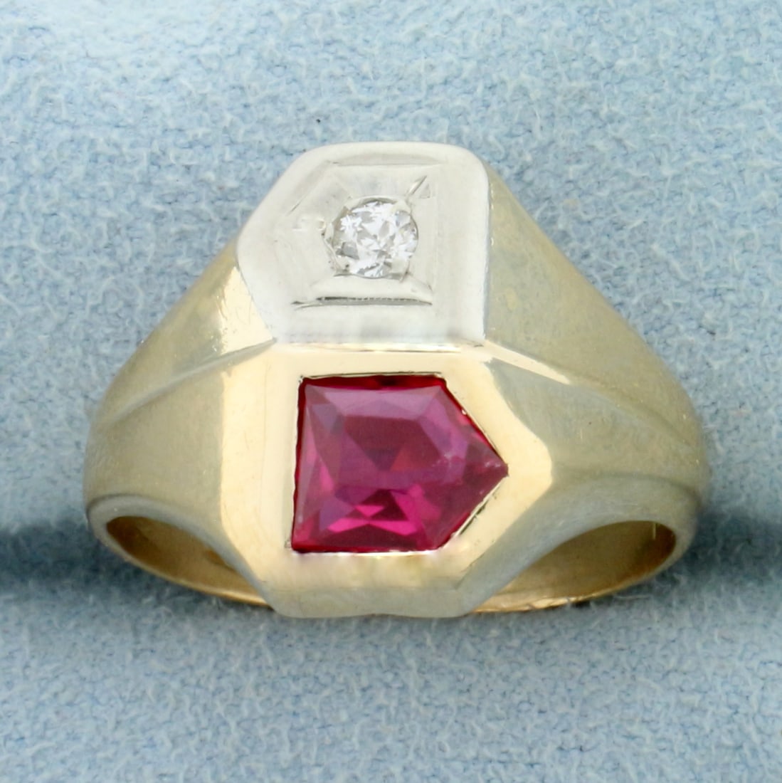 Antique Natural Ruby and Old European Cut Diamond Ring in 14K Yellow Gold: In 14K Yellow Gold. Contains one bezel set 7x6mm fancy cut natural Ruby gemstone with intense color and excellent clarity. Also contains one old European cut Diamond, illusion set, .1ct, VS clarity/H
