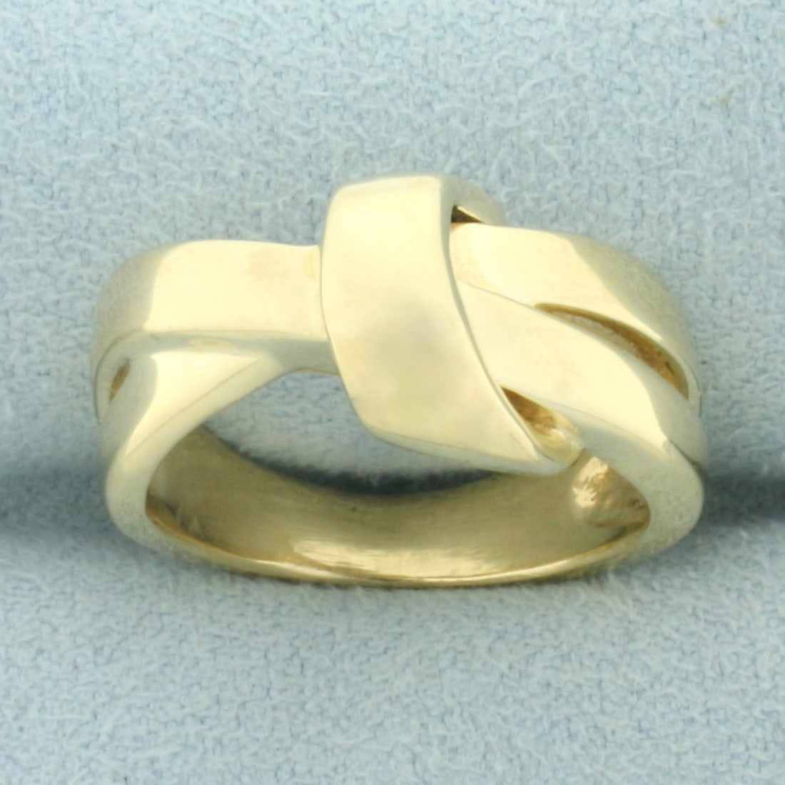 Ribbon Design Ring in 14k Yellow Gold: In 14k yellow gold. 11mm wide at top of ring. Size: 5.5. 8.9g.