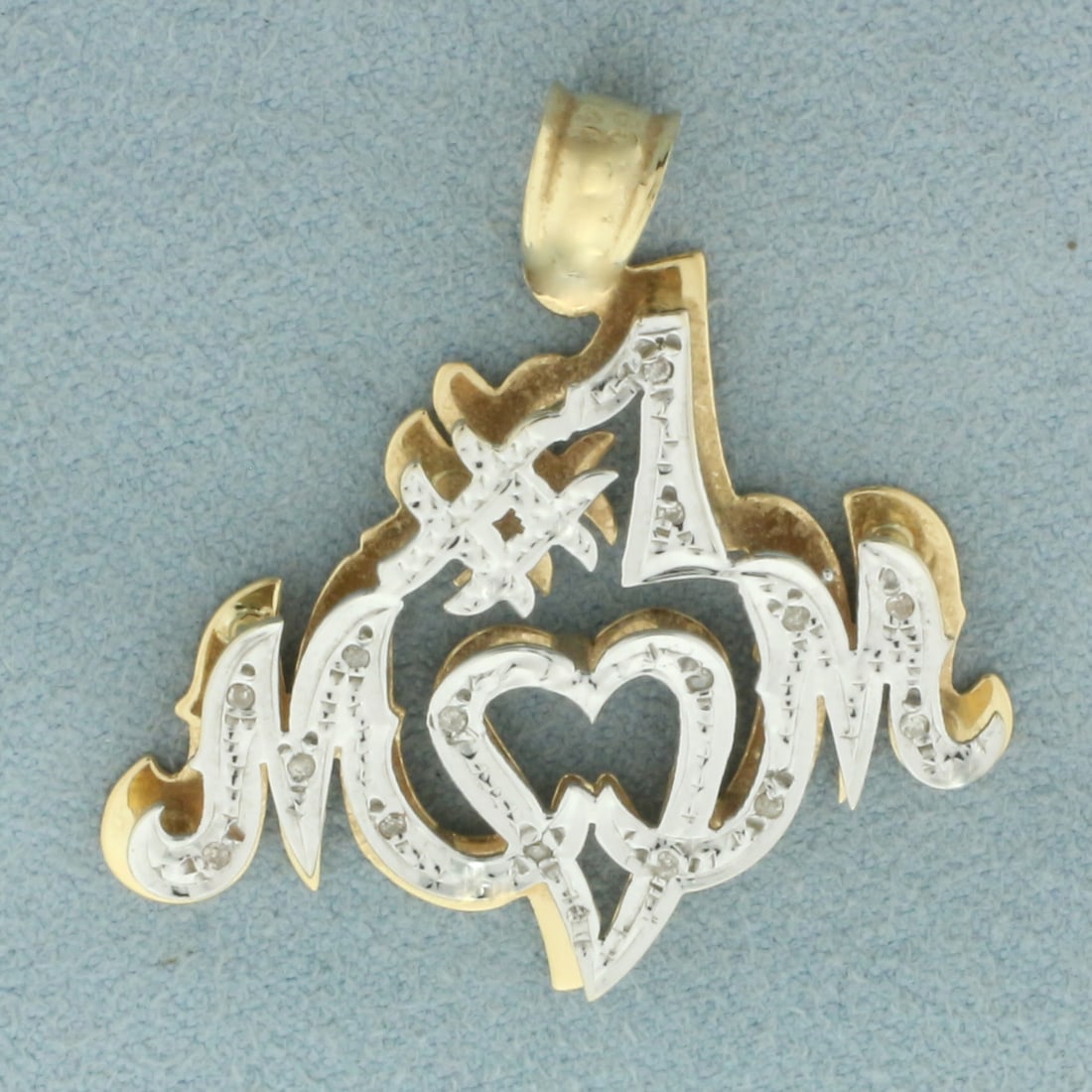 Number One Mom Diamond Pendant in 14k Yellow Gold: In 14k yellow gold. Contains fifteen high quality 1/2pt diamonds. 1 3/8 inches long and 1 1/4 inches wide. 3.5g.