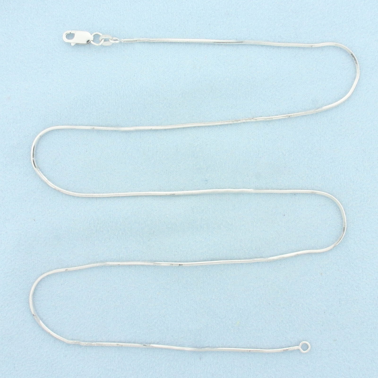 20 Inch Squared Snake Link Chain Necklace in 14k White Gold: In 14k White Gold. 20 inches long. 1.2mm wide. Lobster clasp. 6.0g.