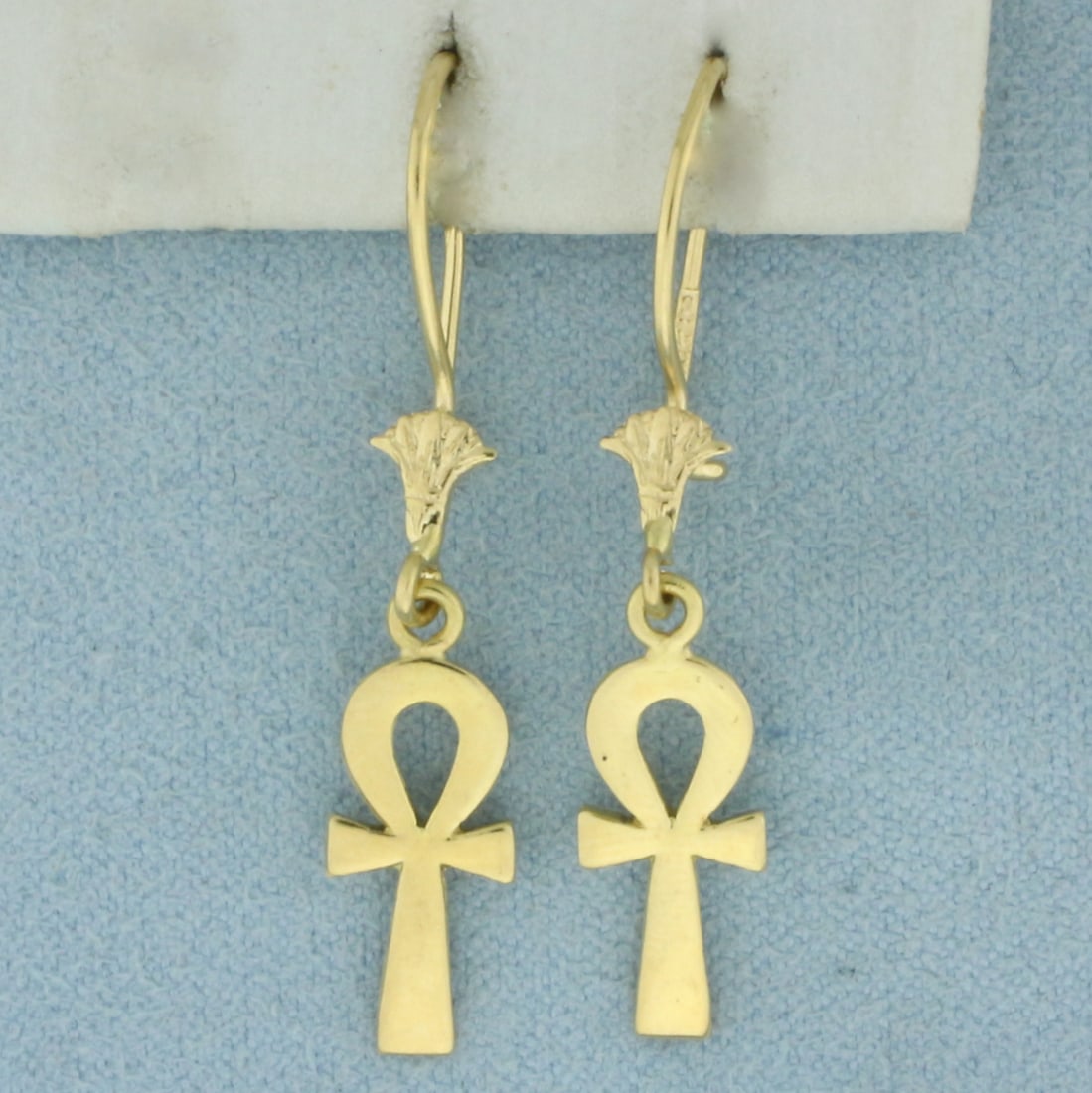 Egyptian Ankh Dangle Earrings in 21k Yellow Gold: In 21k Yellow Gold. 1 inch long. 1/4 inch wide at widest. Kidney ear wire closure. 2.5g.