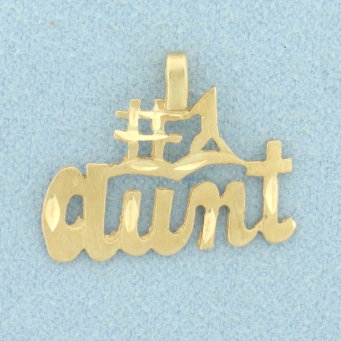 Diamond Cut #1 Aunt Pendant in 14k Yellow Gold: In 14k Yellow Gold. 5/8 inch long. 7/8 inch wide. 1.0g.